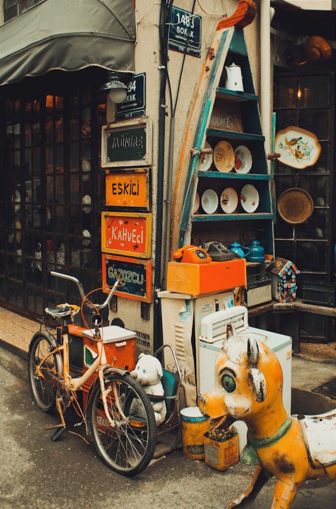 Charming vintage street corner in İzmir with old signs and retro objects, evoking nostalgia.